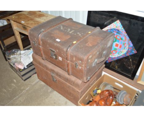 A leather bound and wooden travelling trunk; and a tin trunk