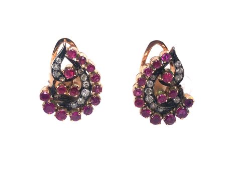 AN ANTIQUE PAIR OF DIAMOND AND RUBY, PRECIOUS YELLOW METAL CLIP ON EARRINGS. THE GRADUATED ARCH OF ELEVEN RUBIES IN CLAW SETT