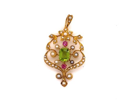 AN ANTIQUE EDWARDIAN ART NOUVEAU 15ct GOLD PERIDOT, SEED PEARL AND RUBY FLORAL PENDANT. MEASUREMENTS 4.3 X 2.5cms, WEIGHT 5.6