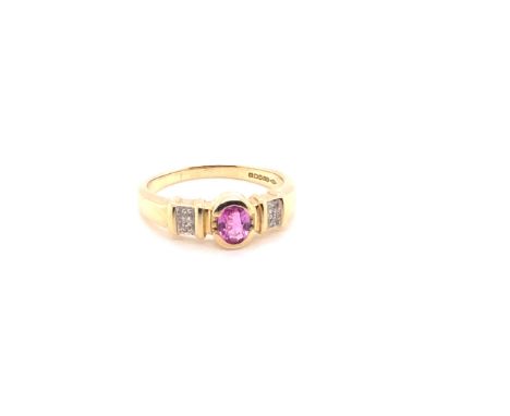 A 9ct YELLOW GOLD HALLMARKED PINK RUBY AND DIAMOND SET RING. FINGER SIZE L 1/2. WEIGHT 2.5grms. 