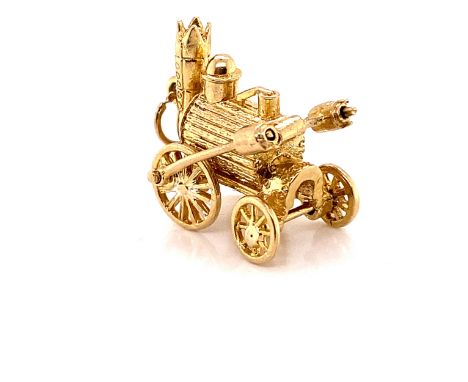 A PRECIOUS YELLOW METAL ASSESSED AS 9ct FINENESS, CHARM/ PENDANT IN THE FORM OF THE STEVENSONS ROCKET STEAM ENGINE WITH ROTAT