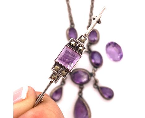 AN AMETHYST AND  WHITE PRECIOUS METAL, TESTS AS STERLING SILVER, LAVALIER NECKLACE, AN ART DECO STYLE AMETHYST AND MARCASITE 