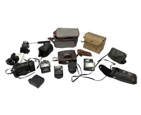 Quantity of cameras and accessories to include Olympus Trip 35, Minolta A f-EII 35mm, Yashica Auto Focus camera, Hanimex 35mm