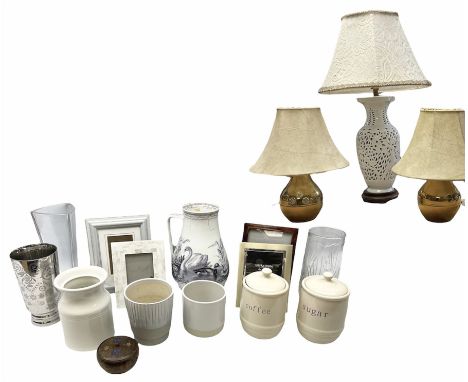 Blanc de Chine ceramic table lamp having a pierced body with lattice work decoration upon a wooden base, together with a pair