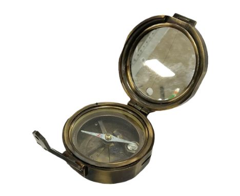 Brass military compass marked Brinton Compass, Thos Evans and Son London, L9cm