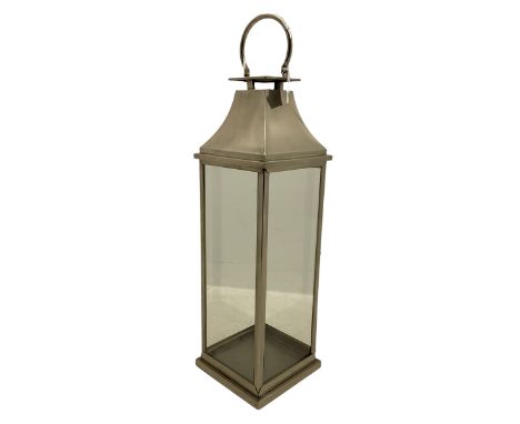 Chrome finish floor lantern, four glass sides, loop handleDimensions: Height:&nbsp;116cm&nbsp; Length/Width:&nbsp;31cm&nbsp; 