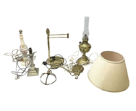 Converted oil lamp, brass table lamp with extendable arm, together with two other lamps, a lampshade and a wall sconce  