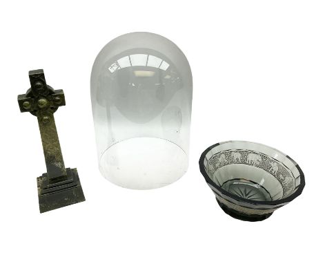 Clear glass display dome, dark glass bowl with elephant decoration banding and carved stone celtic cross