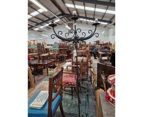 AN IRON TRIPOD THREE LIGHT CANDELABRUM