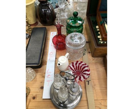 A CRANBERRY GLASS DECANTER, A SPIRIT DECANTER, GLASS JARS AND AN ELECTROPLATE FOUR BOTTLE CRUET