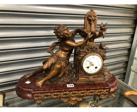 A 19th C. FRENCH SPELTER AND RED MARBLE CLOCK FLANKED BY A NYMPH RAISING HANDS UP TO A WATER FOUNTAIN