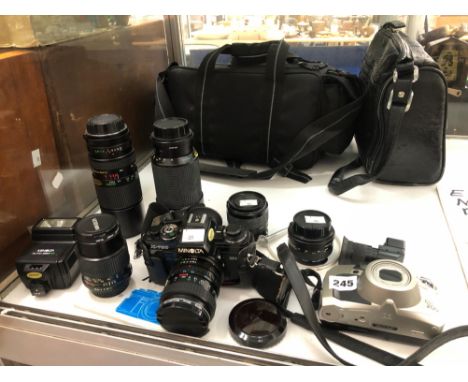 A MINOLTA X-700 CAMERA, SIX VARIOUS LENSES TOGETHER WITH A PENTAX ESPIO 200 CAMERA