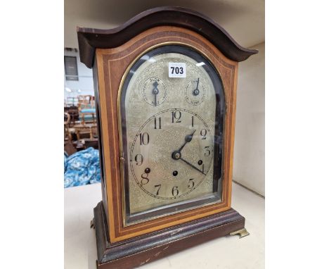 A GERMAN SATIN WOOD BANDED MAHOGANY MANTEL CLOCK, THE MOVEMENT CHIMING ON RODS, THE SILVERED DIAL WITH ARABIC NUMERALS