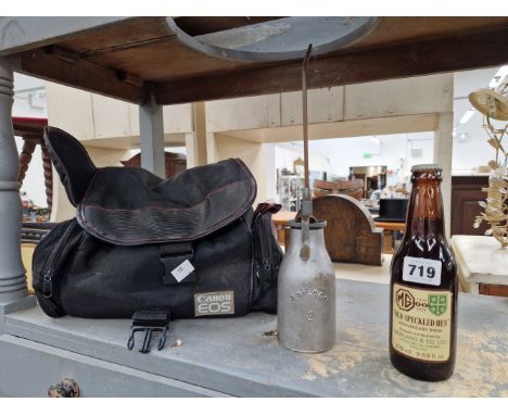 A CANON EOS 700 CAMERA, AN OIL CAN, A BOTTLE OF MG COMMEMORATIVE BEER TOGETHER WITH FORD POPULAR AND PREFECT FLIERS