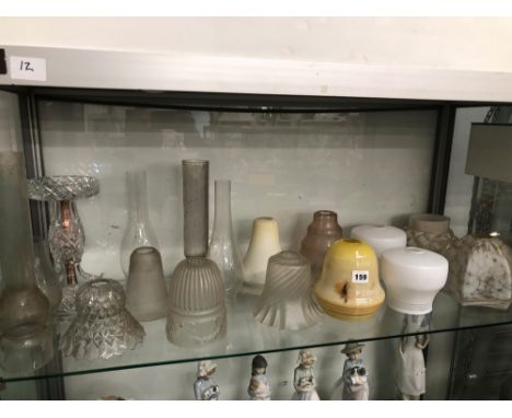 A COLLECTION OF GLASS LIGHT AND STORM SHADES