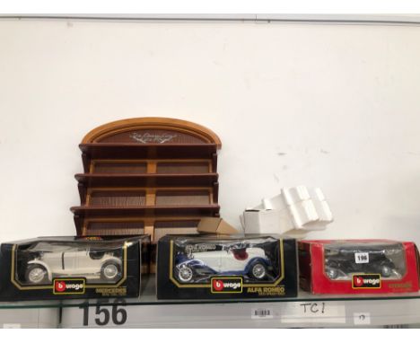 THREE BOXED BURAGO DIE CAST TOYS, A DISCOVERY FORK LIFT TRUCK AND A TIN PLATE INTERCONTINENTAL TRUCK