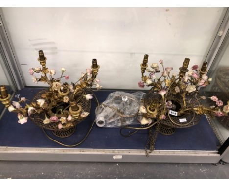 A PAIR OF PORCELAIN FLOWER AND GILT METAL BASKET SIX LIGHT TABLE LAMPS