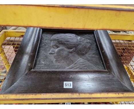 M V M CARR, 1913, A FRAMED METAL RELIEF PLAQUE OF A LADYS HEAD