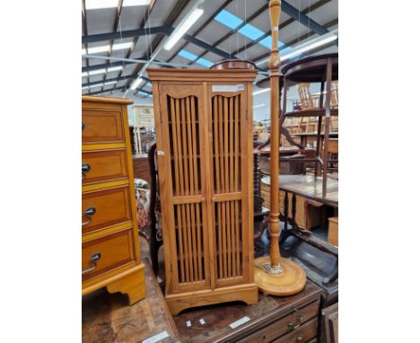 A SMALL HARDWOOD CABINET AND A STANDARD LAMP. 106 X 44 X 22CMS.