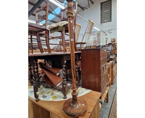 A CARVED WOOD STANDARD LAMP. 
