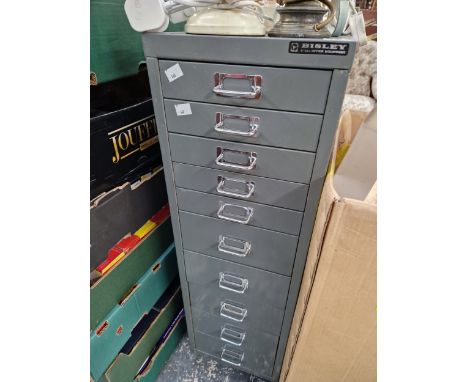 A BISLEY TEN DRAWER METAL FILING CABINET CONTAINING SOME TOOLS AND CLOCK PARTS