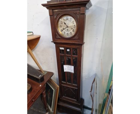 AN OAK LONGCASE CLOCK. 