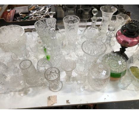 DECANTERS, CUT GLASS VASES, BOWLS AND DRINKING GLASS TOGETHER WITH AN OIL LAMP