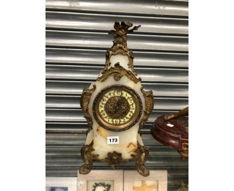 A ROCOCO ORMOLU MOUNTED AGATE MANTEL CLOCK STRIKING ON A COILED ROD