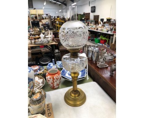A VINTAGE BRASS OIL LAMP WITH ETCHED SHADE