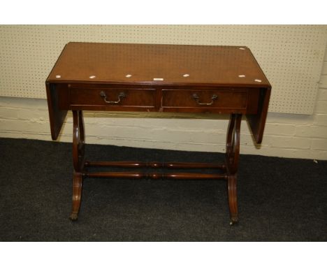 A reproduction burr walnut veneered sofa table on lyre end supports, swept legs and castors. 73 x 53 x 150cm (open)