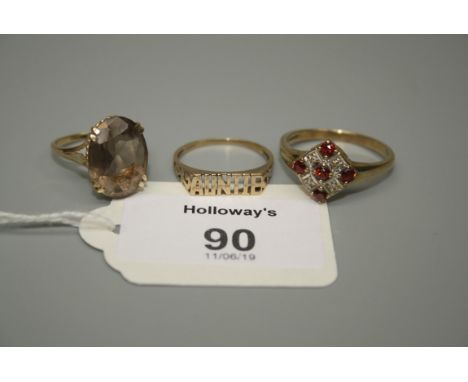 A single stone smoky quartz ring in 9ct gold mount, together with a garnet and diamond cluster ring and one other