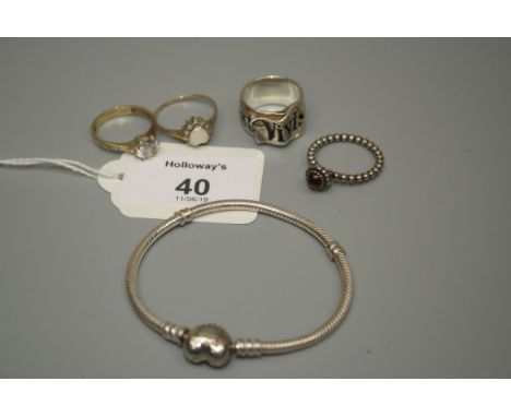 A single stone ring in shank, marked 585, a heart shaped opal cluster ring and three further items including a Pandora bracel