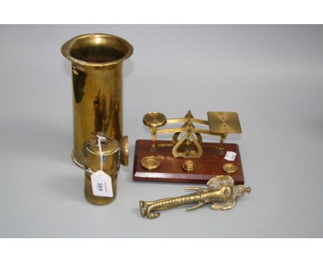 An early brass Meredith miners lamp, a set of brass postal scales, other decorative brassware, a hammered pewter tea service 