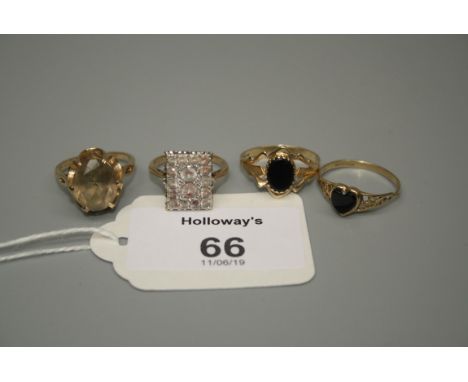 A single stone smoky quartz dress ring together with three further rings 9.0g overall