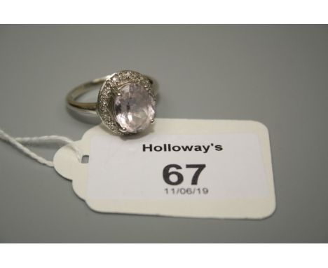A pink quartz and diamond set cluster ring in 9ct gold mount 4.1g, Ring size S