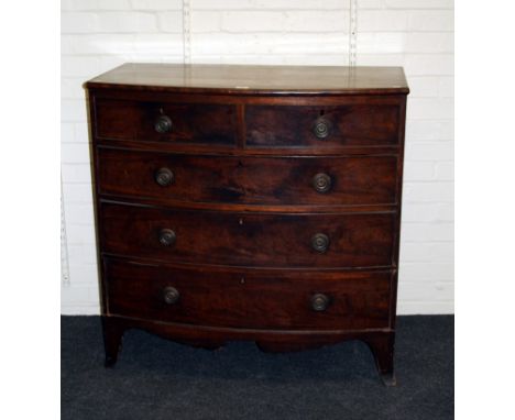 A Regency mahogany bow front chest of two short and three graduated long drawers each with ring handle, on splayed supports. 