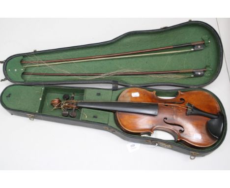 A 19th century full size violin and two bows in a fitted case. Length of back 35.5cm (not including button)