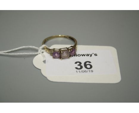 An amethyst and diamond half hoop ring