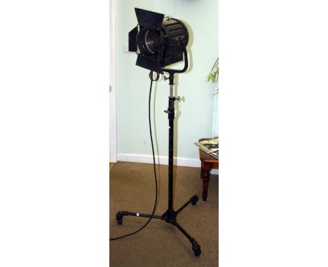 A circa 1930's/1940's Mole Richardson type 406 solarspot studio lamp on a telescopic tubular steel column, three splayed legs