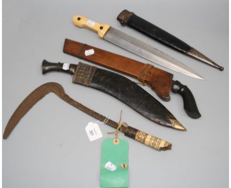 A 19th century Kukri with horn handle in white metal mounted leather scabbard, a Middle Eastern ivory handled dagger with dou