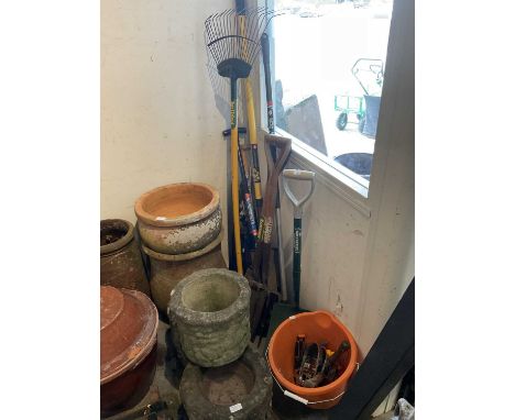 Group of gardening tools to include spades, rakes and others
