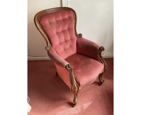 Victorian rosewood framed armchair with red button upholstery, raised on castors