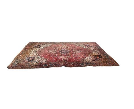 Eastern carpet on red ground, 335cm x 244cm