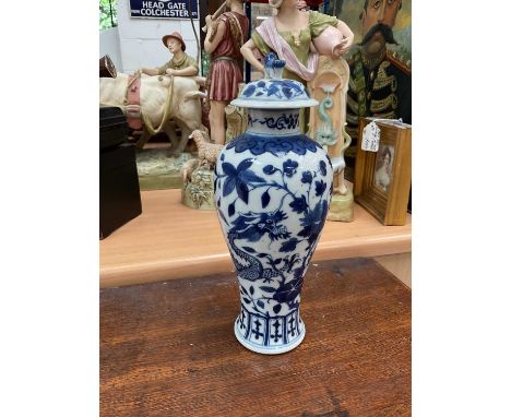 19th century Chinese blue and white porcelain vase and cover, painted with dragons and flowers, 27cm highIn good condition wi