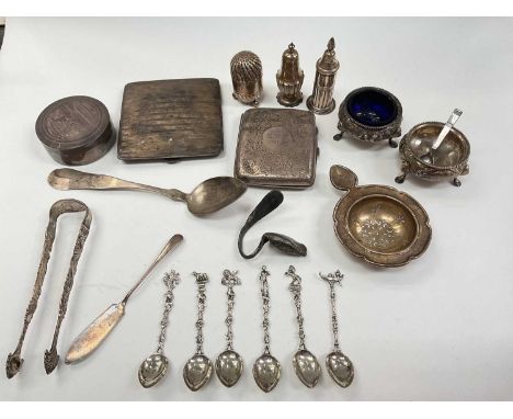 Group of silver and white metal items including condiments, tea strainer, cigarette case, pair of suagr tongs, spoons etcTota
