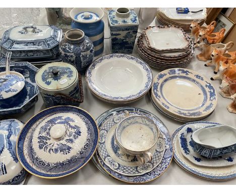 Group of blue and white ceramics including a T. G Green storage jar and a collection of cow creamers