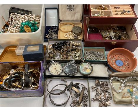 Collection of vintage costume jewellery to include a silver charm bracelet, silver bangles, silver identity bracelet, wristwa