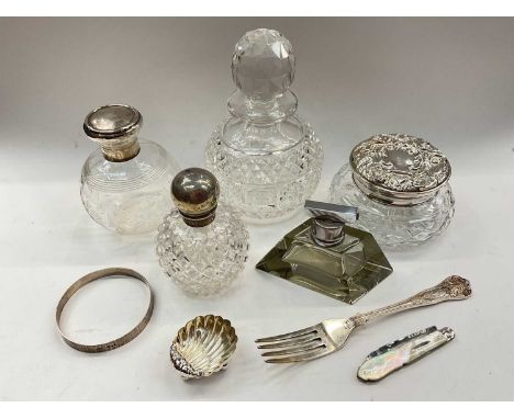 Two silver mounted glass scent bottles, silver mounted glass powder pot, other bottles, silver shell salt, silver bangle, Vic