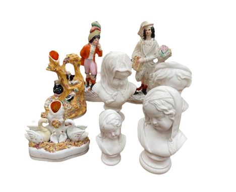 Four 19th century Staffordshire pottery figure groups, Parian Bust of Grief, another of the crying child and another of winte