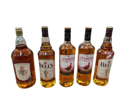 Five bottles of whiskey to include Bells, The Famous Grouse and scotch whiskey